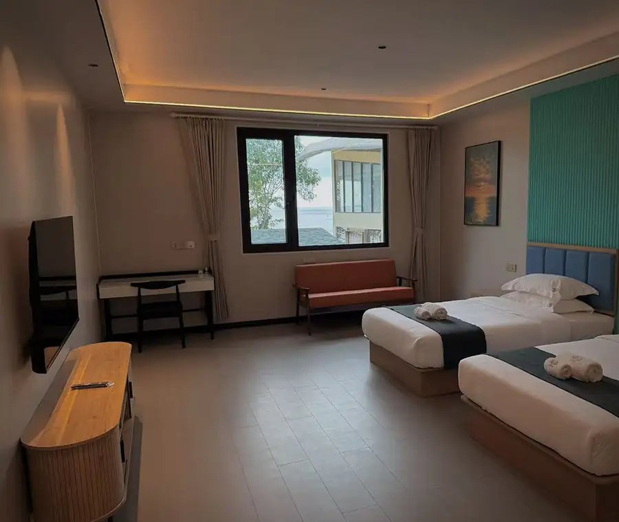 Suite with two single beds, a sofa under the window, a desk and a wall television, Standard Suite, Doris Mataking Resort