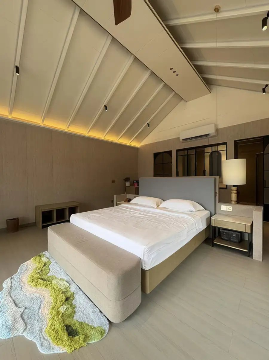 Bedroom with a large bed, a bedside lamp and a vaulted timber ceiling, Superior Garden Room, Doris Mataking Resort